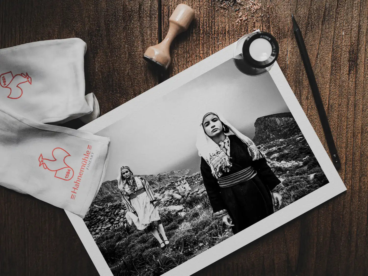 Black and White Photography Wall Art Greece | Costumes of Tilos island at a windy cliff Dodecanese Greece by George Tatakis - photo print on table