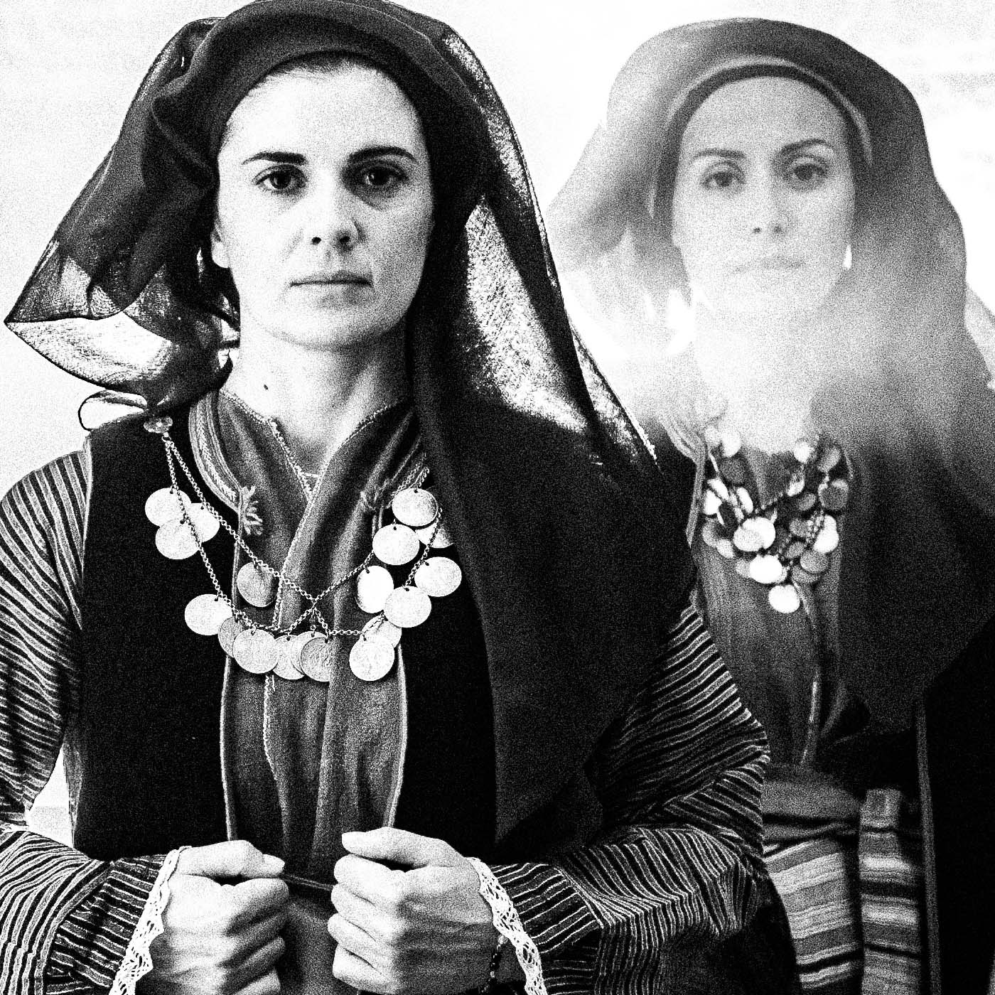 Four women in Alagonia local costumes at the church of the Mandraki Monastery, Alagonia, Peloponnese, Greece. Black and white photography close-up detail by George Tatakis.