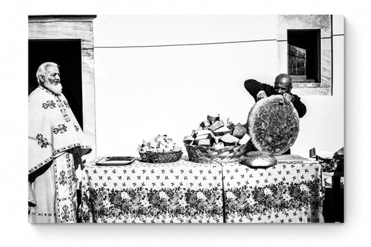 Black and White Photography Wall Art Greece | Cutting bread during a feast in Tristomo Olympos Karpathos Dodecanese by George Tatakis - whole photo