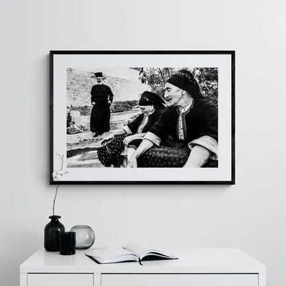 Black and White Photography Wall Art Greece | Two women in their traditional costumes the priest Olympos Karpathos Dodecanese by George Tatakis - single framed photo