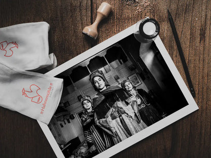 Black and White Photography Wall Art Greece | Three ladies in the traditional costumes of Symi island inside a house Dodecanese Greece by George Tatakis - photo print on table