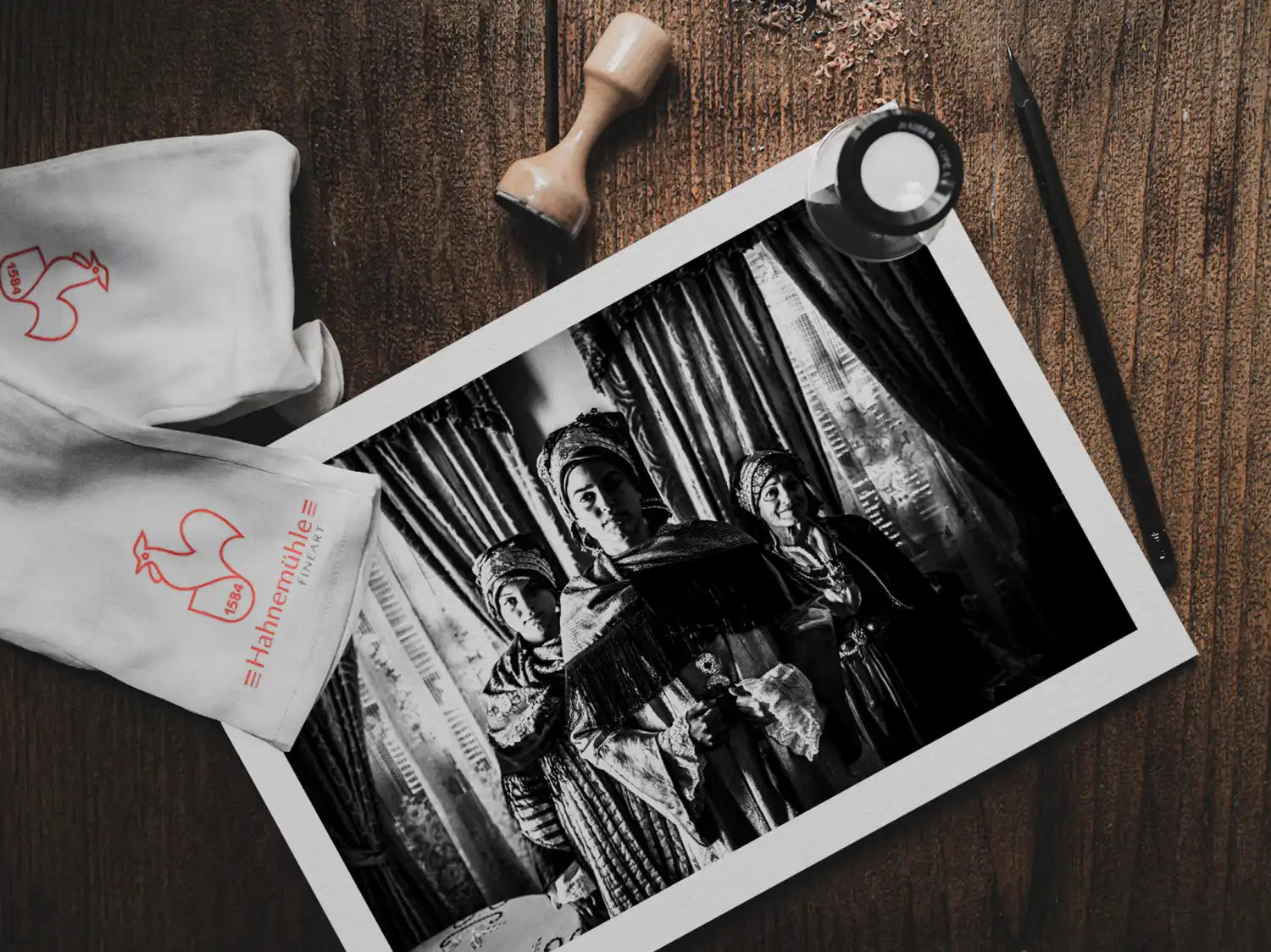 Black and White Photography Wall Art Greece | Three ladies in the traditional costumes of Symi island inside a house Dodecanese Greece by George Tatakis - photo print on table