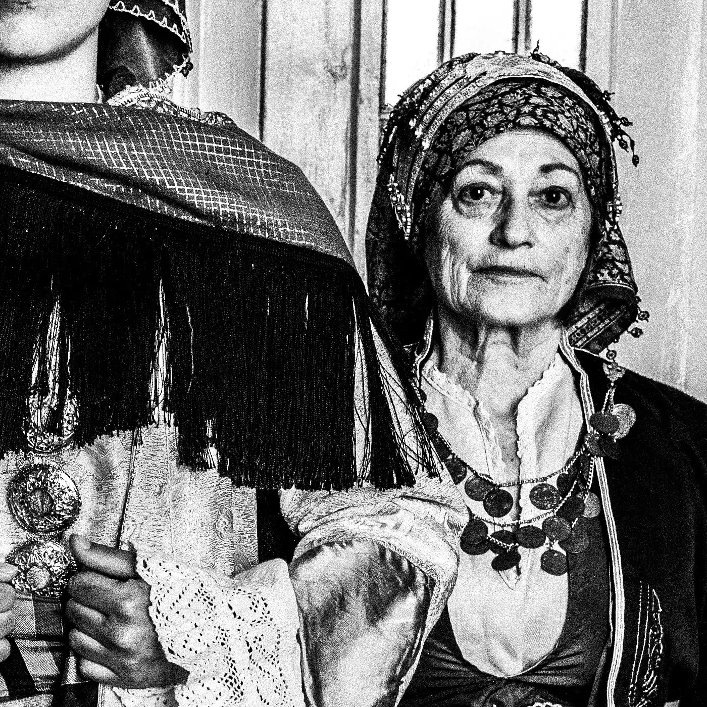 Black and White Photography Wall Art Greece | Three ladies in the traditional costumes of Symi island inside a house Dodecanese Greece by George Tatakis - detailed view