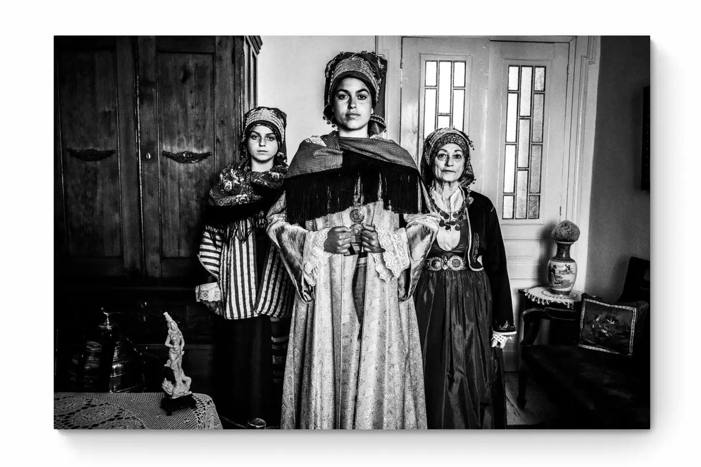 Black and White Photography Wall Art Greece | Three ladies in the traditional costumes of Symi island inside a house Dodecanese Greece by George Tatakis - whole photo