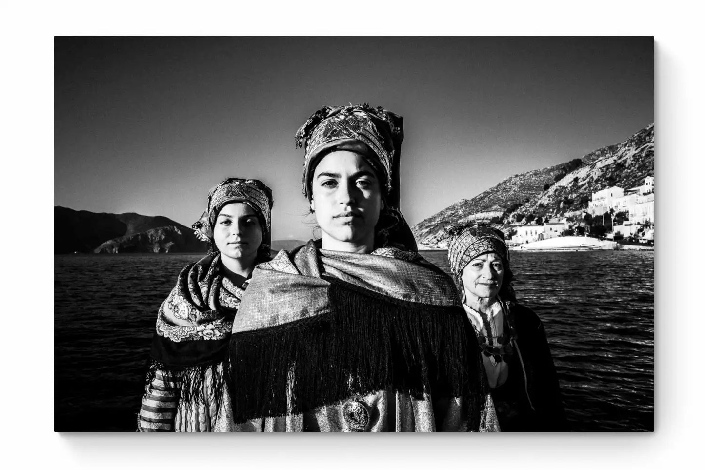 Black and White Photography Wall Art Greece | Three ladies on a boat in the traditional costumes of Symi island Dodecanese Greece by George Tatakis - whole photo