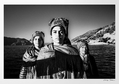 Black and White Photography Wall Art Greece | Three ladies on a boat in the traditional costumes of Symi island Dodecanese Greece by George Tatakis