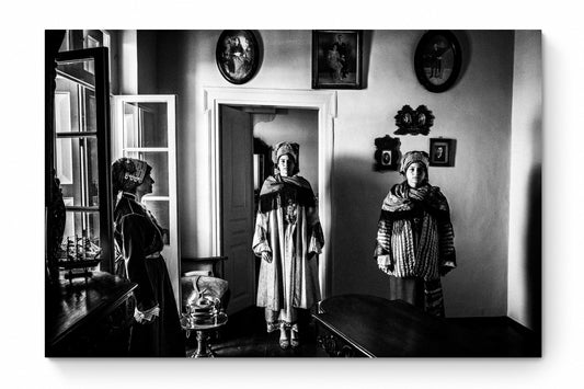 Black and White Photography Wall Art Greece | Three ladies in the traditional costumes of Symi island inside a room with frames Dodecanese by George Tatakis - whole photo