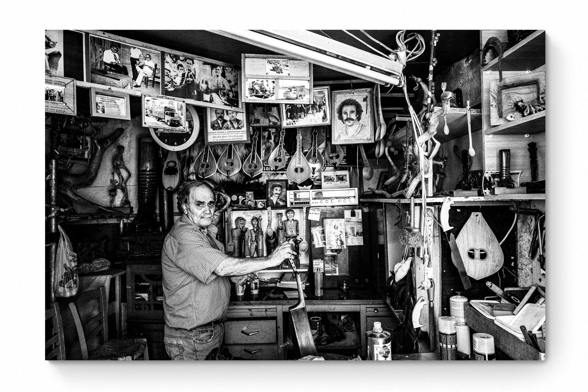Black and White Photography Wall Art Greece | Man in his music instrument workshop Anogia Crete by George Tatakis - whole photo