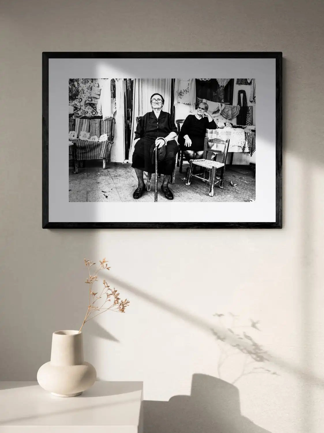 Black and White Photography Wall Art Greece | Two ladies in front of a local shop Anogia Crete by George Tatakis - single framed photo