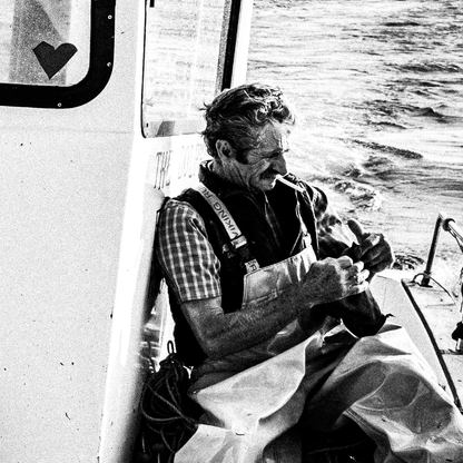 Black and White Photography Wall Art Greece | Fisherman smoking on his boat in Diafani Olympos Karpathos Dodecanese by George Tatakis - detailed view