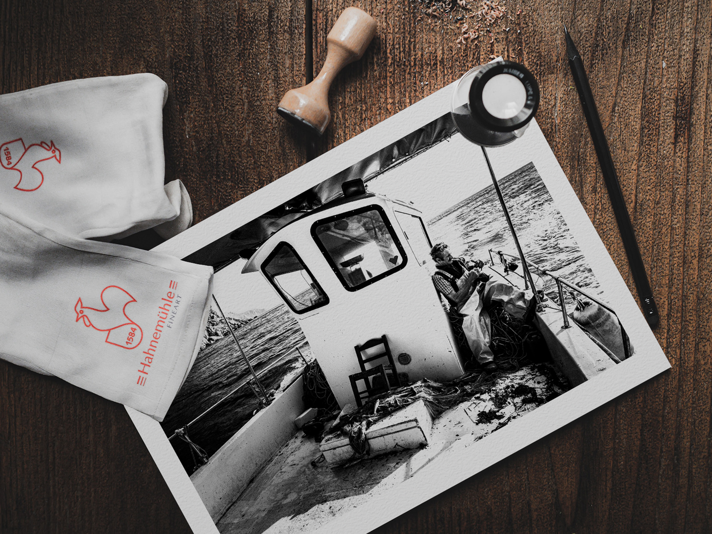 Black and White Photography Wall Art Greece | Fisherman smoking on his boat in Diafani Olympos Karpathos Dodecanese by George Tatakis - photo print on table