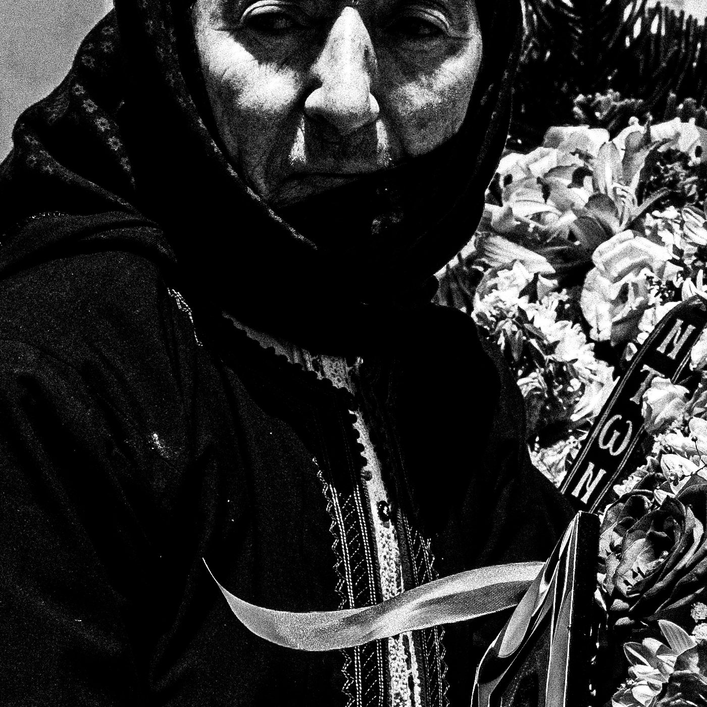 Black and White Photography Wall Art Greece | Woman preparing the Epitaph in her traditional costume Olympos Karpathos Dodecanese by George Tatakis - detailed view