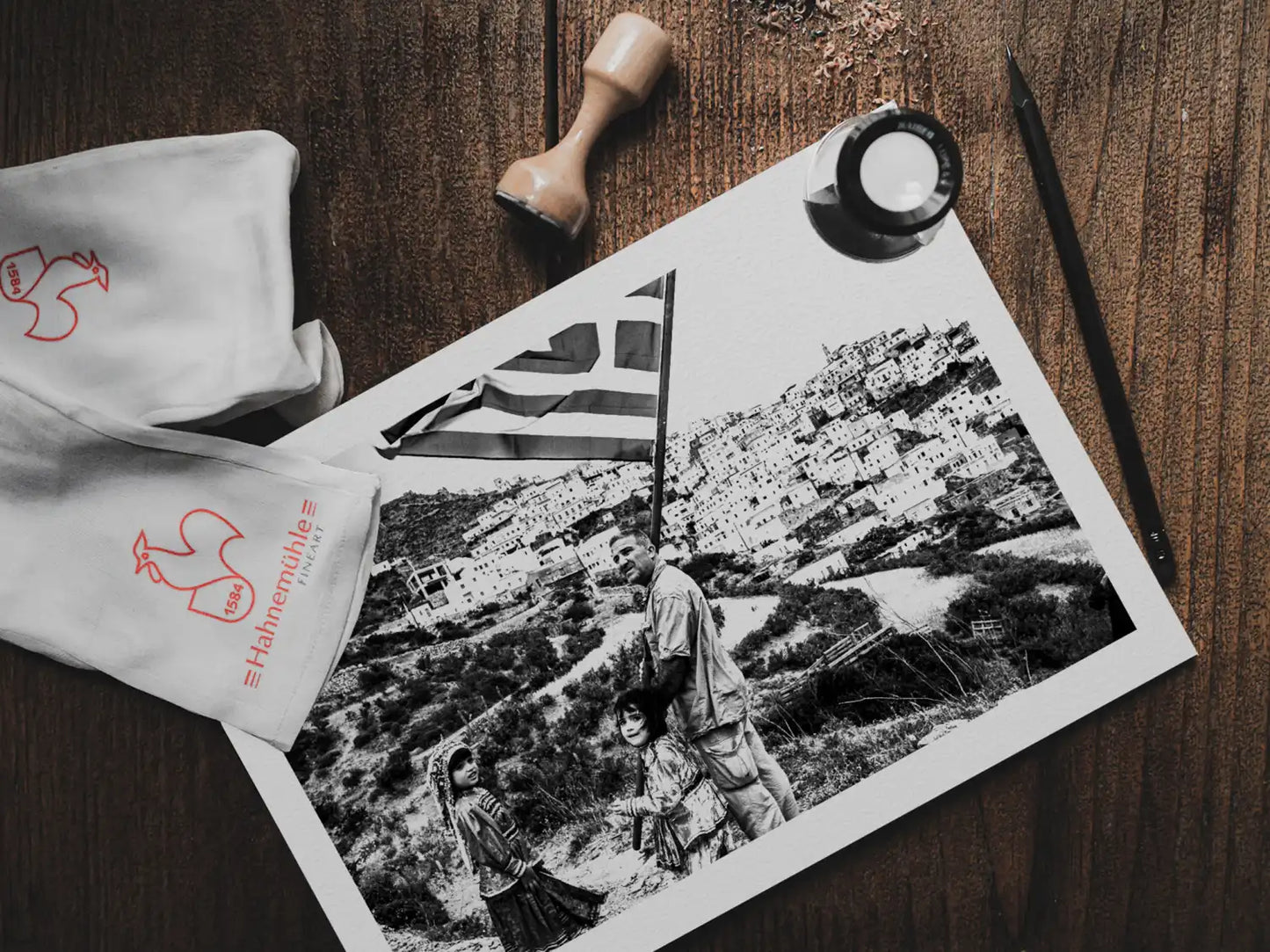 Black and White Photography Wall Art Greece | Carrying the Greek flag in Olympos Karpathos Dodecanese by George Tatakis - photo print on table