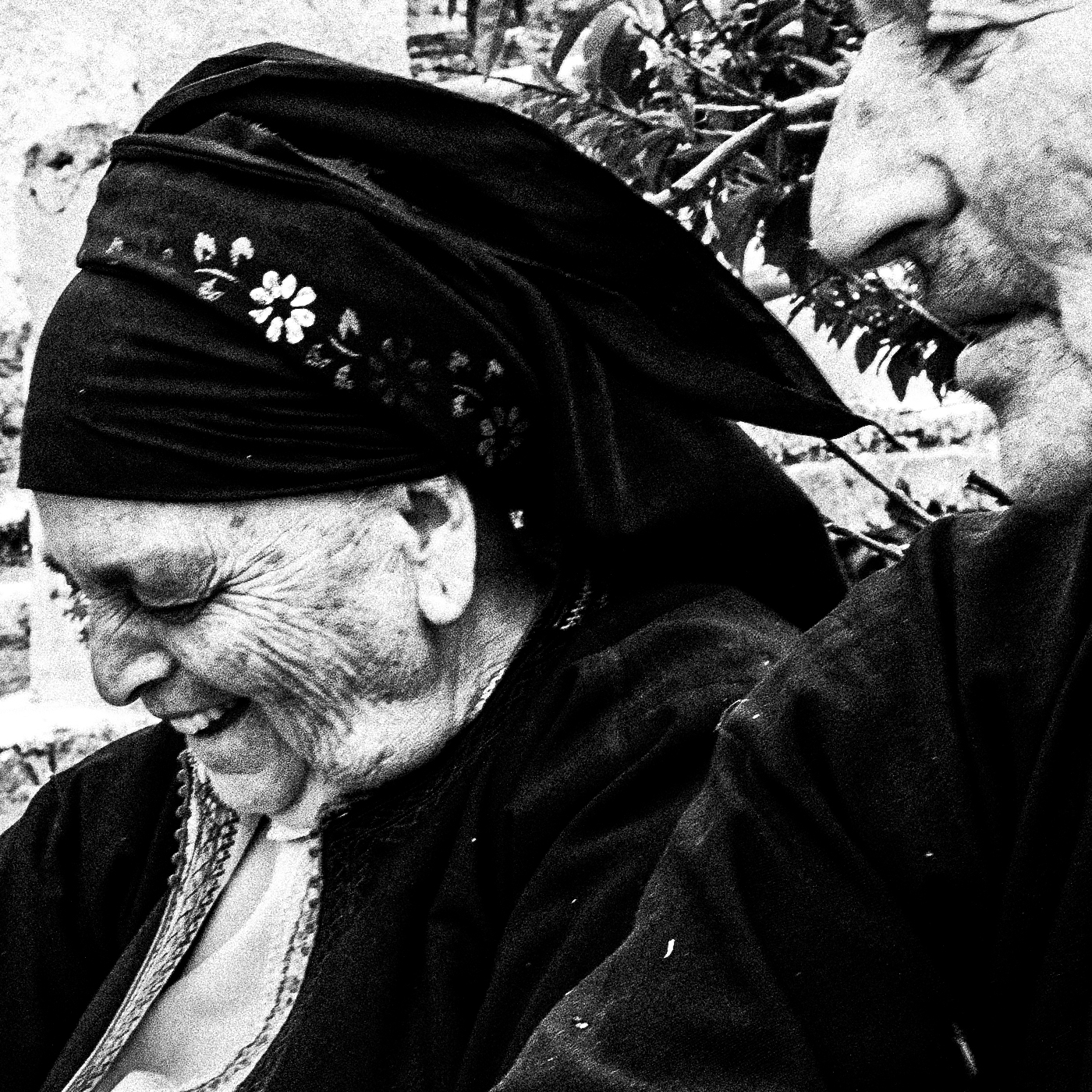 Black and White Photography Wall Art Greece | Two women in their traditional costumes the priest Olympos Karpathos Dodecanese by George Tatakis - detailed view