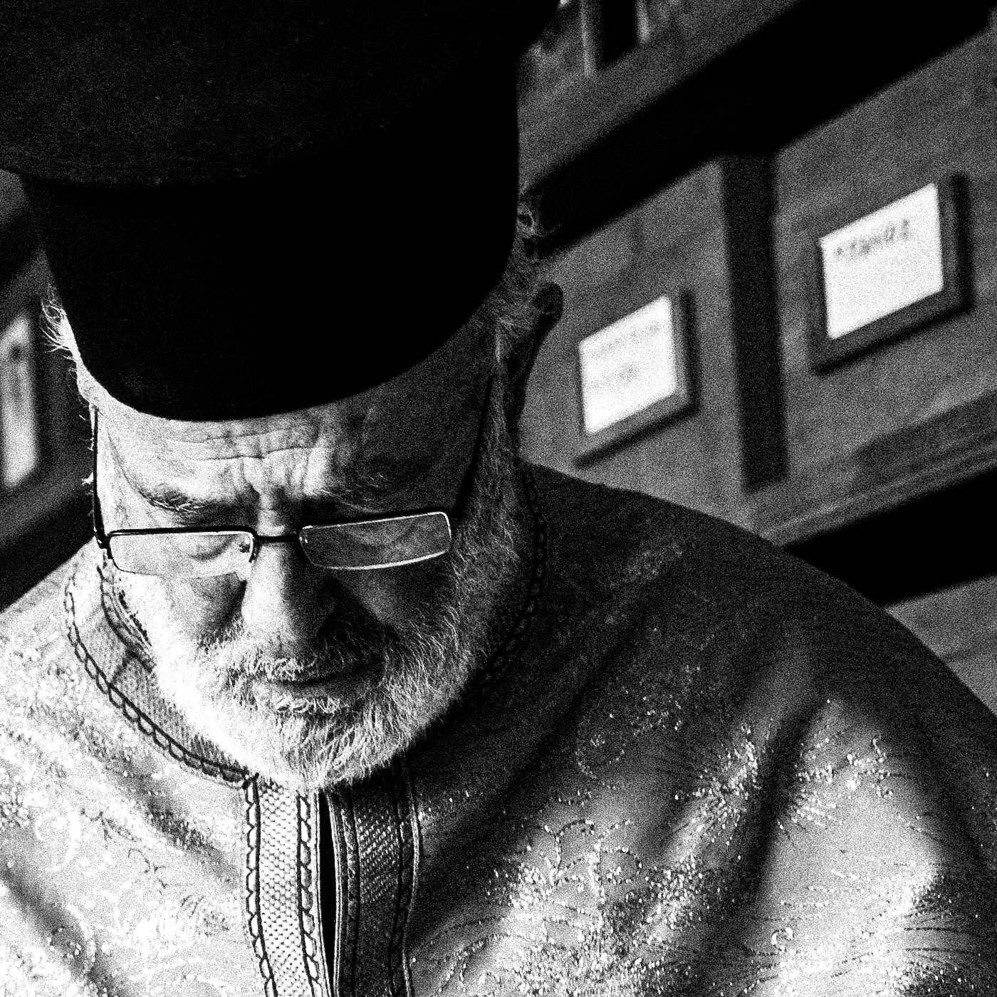 Black and White Photography Wall Art Greece | Blessing in the ossuary Olympos on Easter Tuesday Karpathos Dodecanese by George Tatakis - detailed view