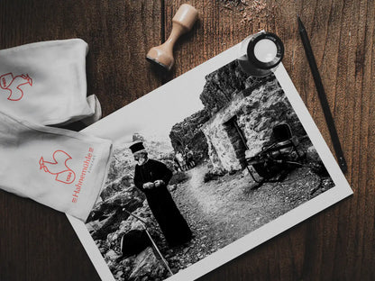 Black and White Photography Wall Art Greece | Priest at the St. John celebration in Vrykounta Olympos Karpathos Dodecanese by George Tatakis - photo print on table