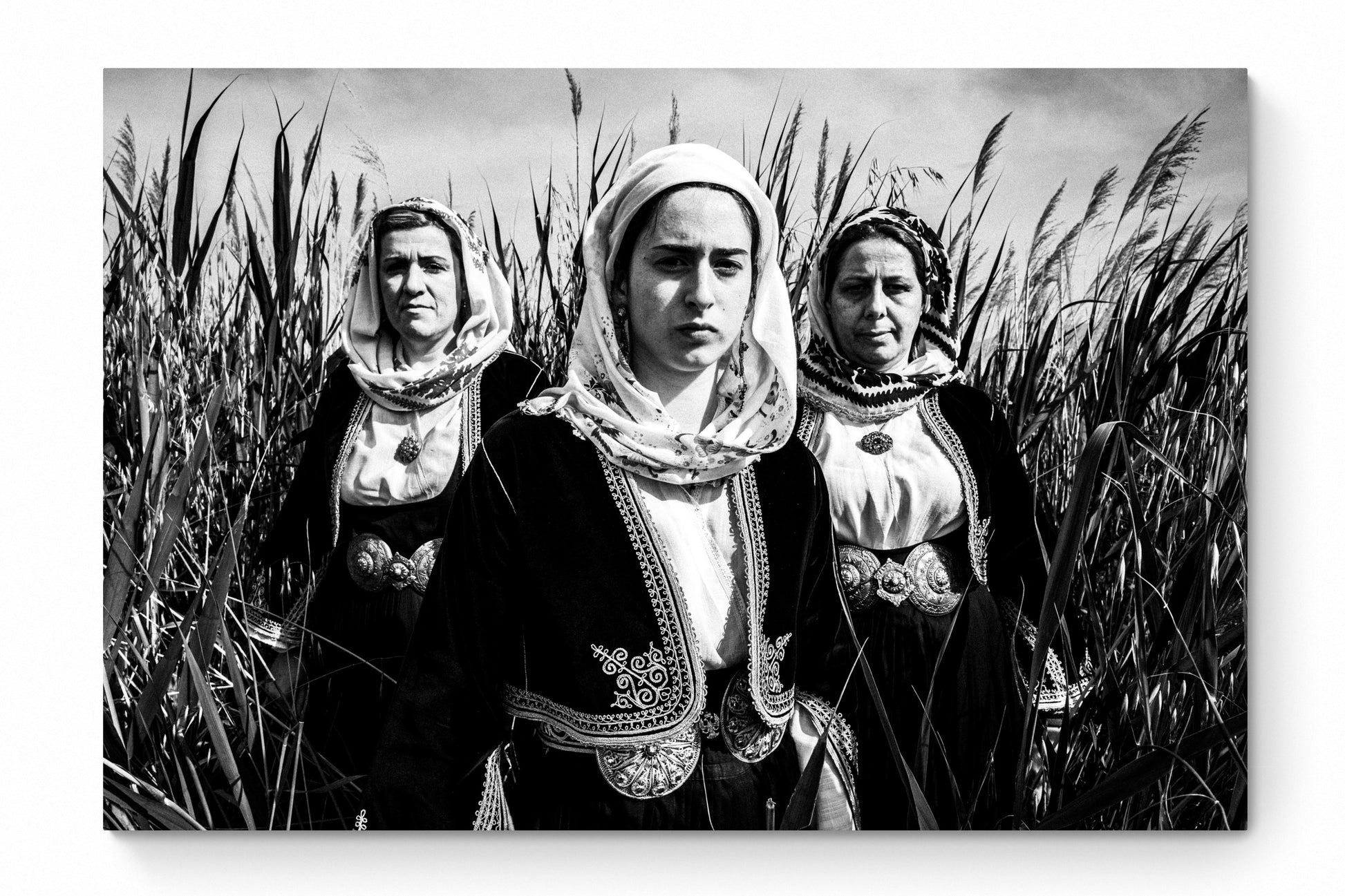 Black and White Photography Wall Art Greece by George Tatakis | Three women in the costume of Kymi in a field of straws, Euboea island - whole photo