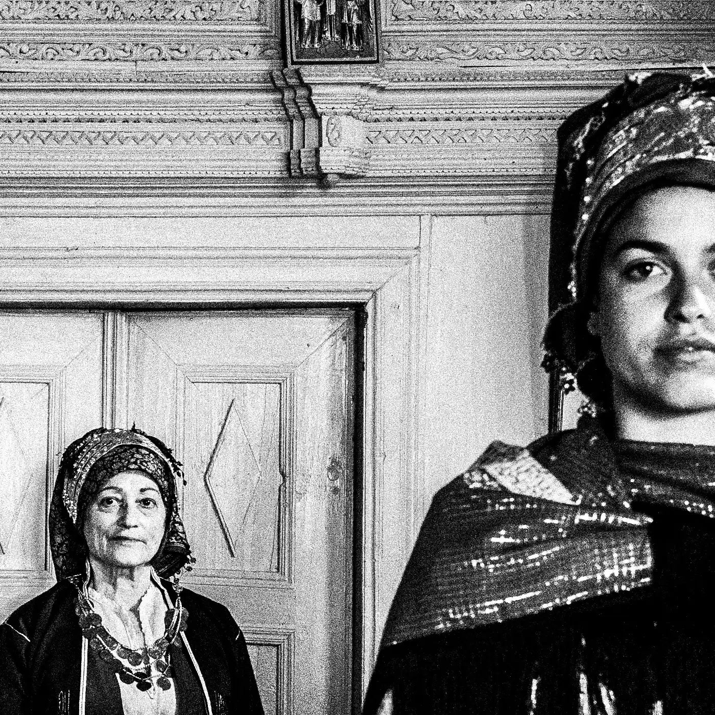 Black and White Photography Wall Art Greece | Three ladies in the traditional costumes of Symi island inside a house Dodecanese Greece by George Tatakis - detailed view