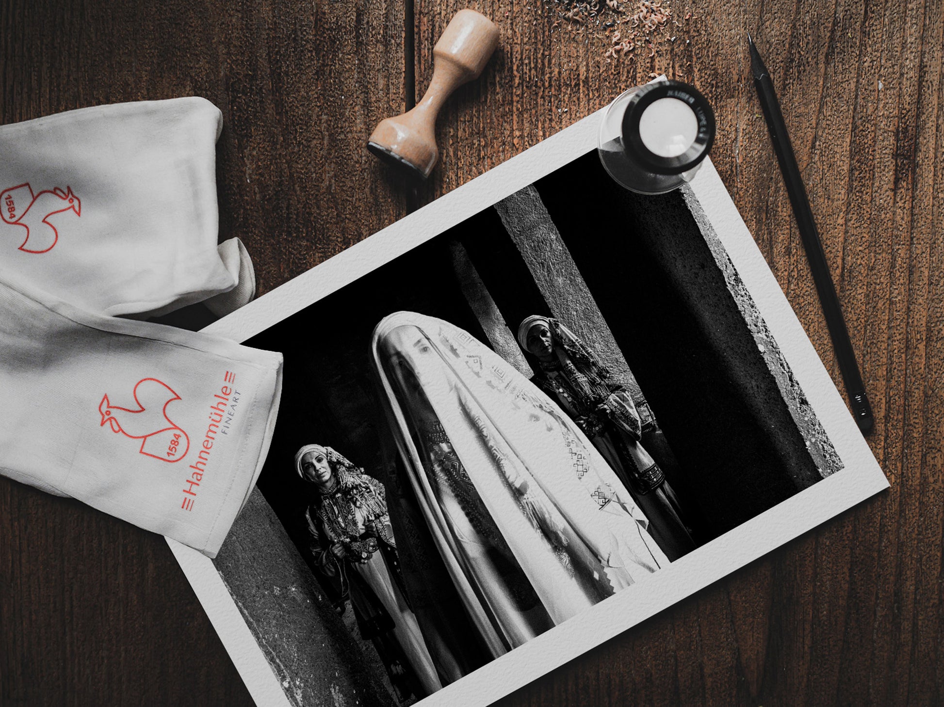 Veiled bride with two supporting figures in Kyparissia local costumes. Peloponnese, Greece. Black and white photography print on a table by George Tatakis.