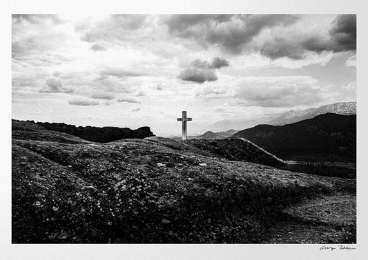 Cross on a rock at Meteora. Black-and-white photography artwork by George Tatakis from the project Chorōs