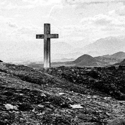 Cross on a rock at Meteora. Black-and-white photography artwork by George Tatakis from the project Chorōs. Close-up detail.