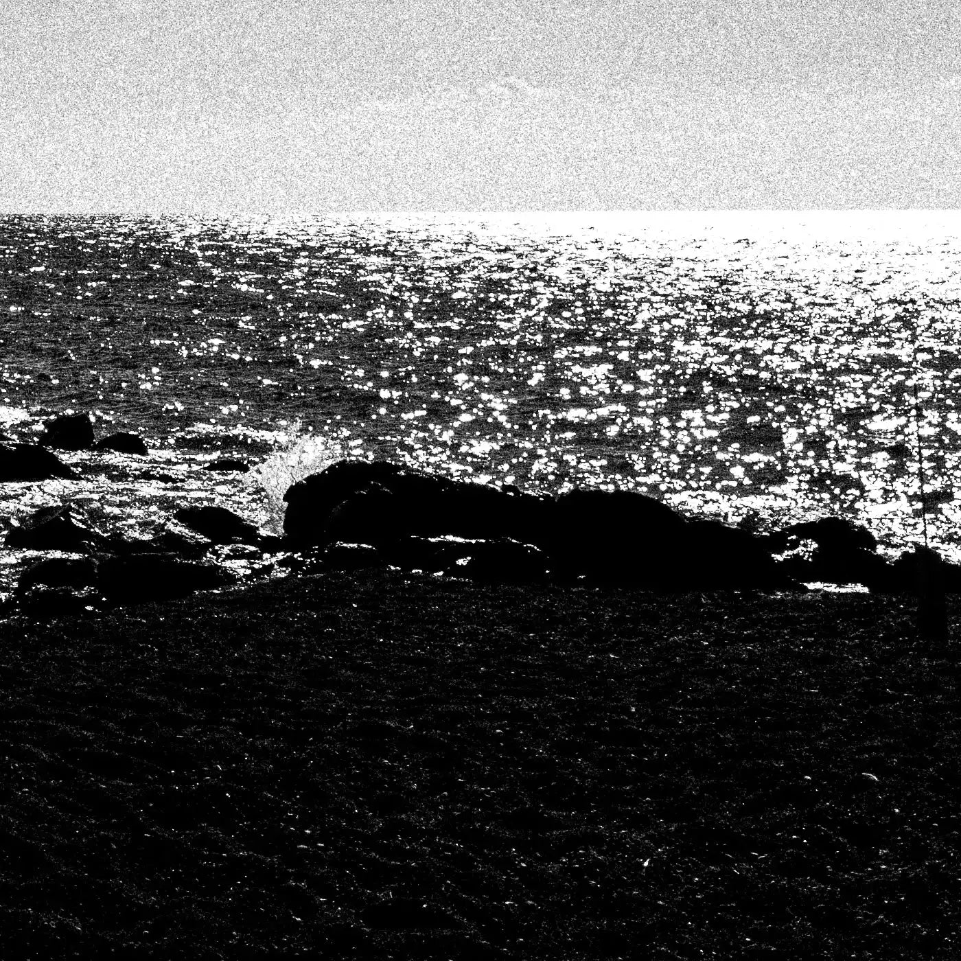 Calm Sunlit Sea | Santorini | Chorōs | Black-and-white wall art photography from Greece - detailed view