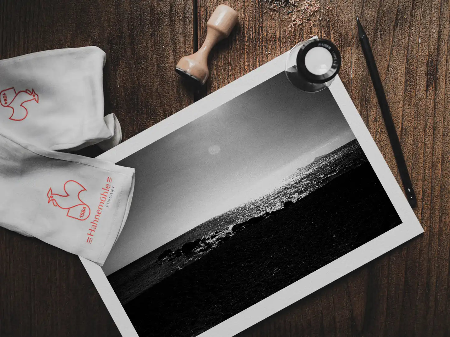 Calm Sunlit Sea | Santorini | Chorōs | Black-and-white wall art photography from Greece - photo print on table