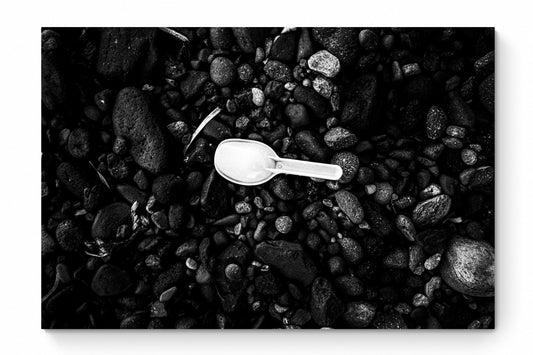 Black Pebbles and Shovel | Santorini | Chorōs | Black-and-white wall art photography from Greece - whole photo