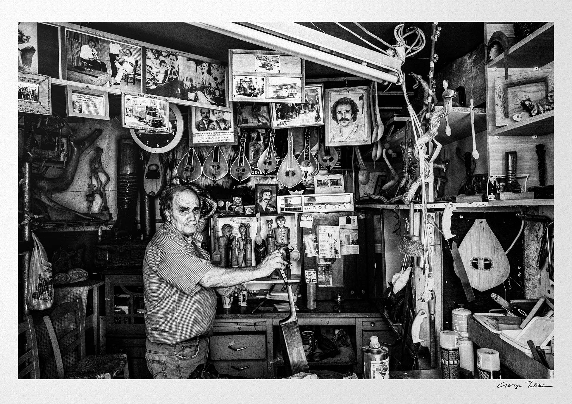 Black and White Photography Wall Art Greece | Man in his music instrument workshop Anogia Crete by George Tatakis