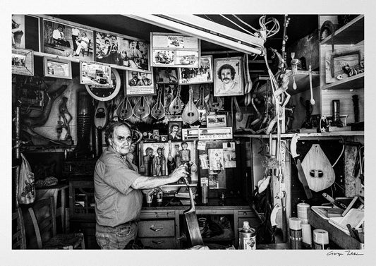 Black and White Photography Wall Art Greece | Man in his music instrument workshop Anogia Crete by George Tatakis