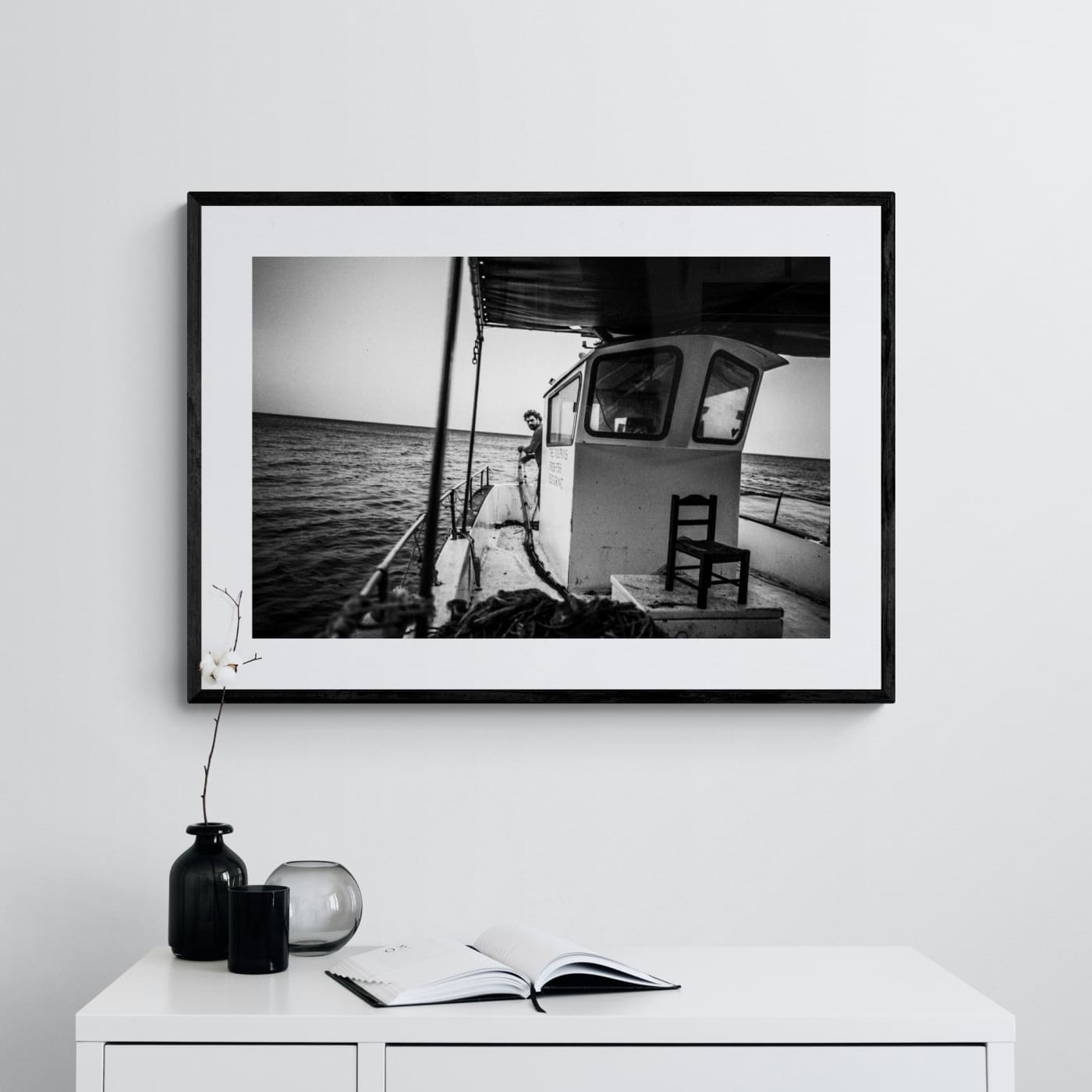 Black and White Photography Wall Art Greece | Fisherman with nets on his boat in Diafani Olympos Karpathos Dodecanese by George Tatakis - single framed photo