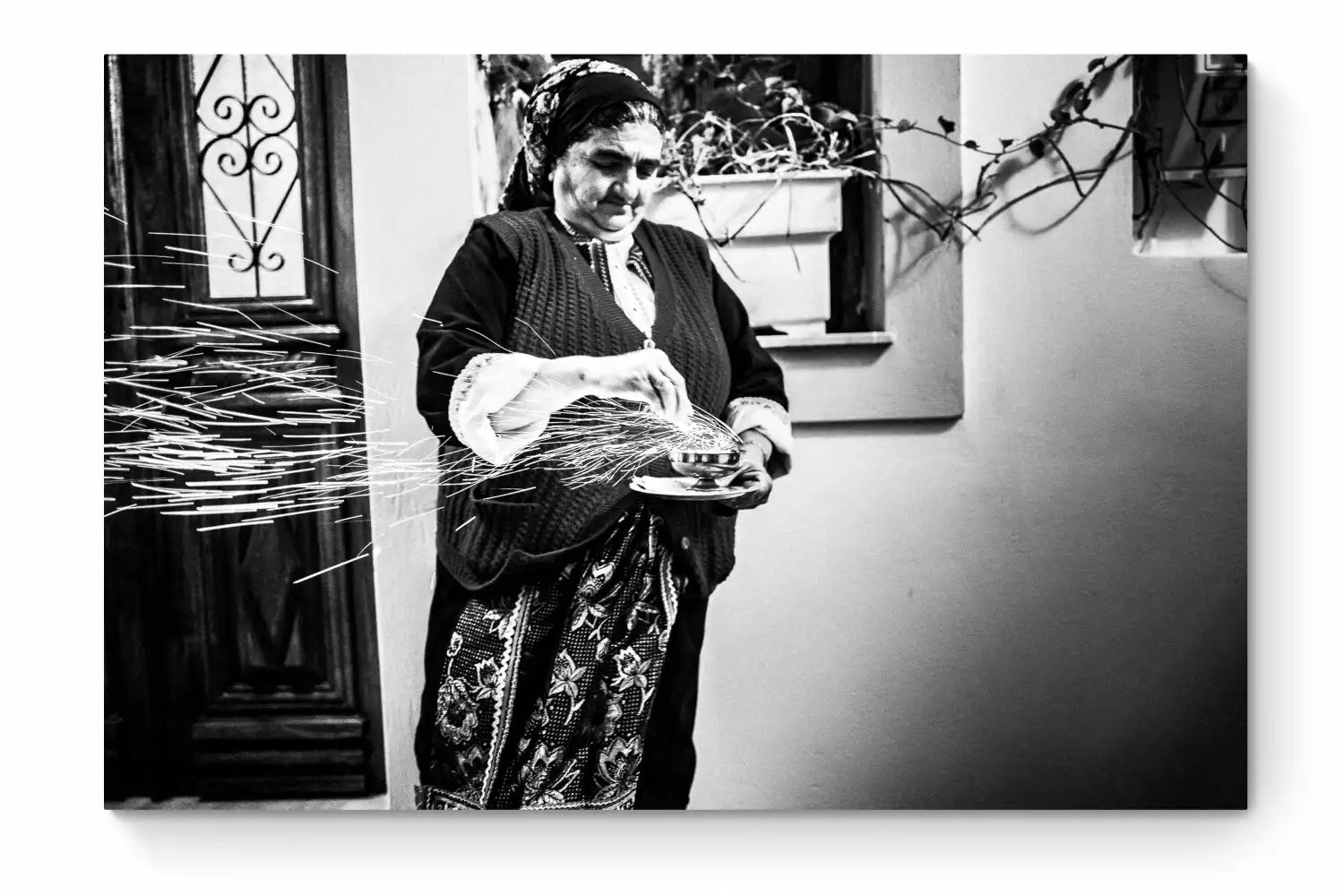 Black and White Photography Wall Art Greece | Woman with sparks during the Litany of Epitaphios Olympos Karpathos Dodecanese by George Tatakis - whole photo