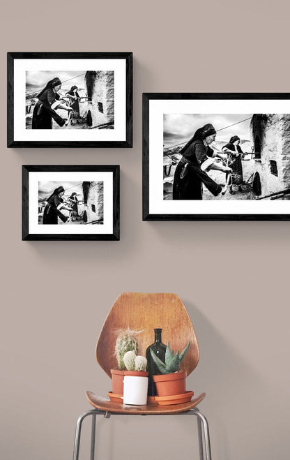 Black and White Photography Wall Art Greece | Women lighting up the wood oven Olympos Karpathos Dodecanese by George Tatakis - framing options