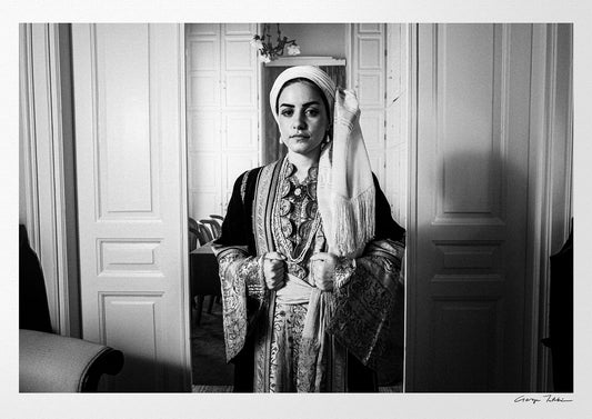 Portrait of a woman in the urban dress of Kalamata at the Lyceum Club of Greek Women. Peloponnese, Greece. Black and white photography by George Tatakis.
