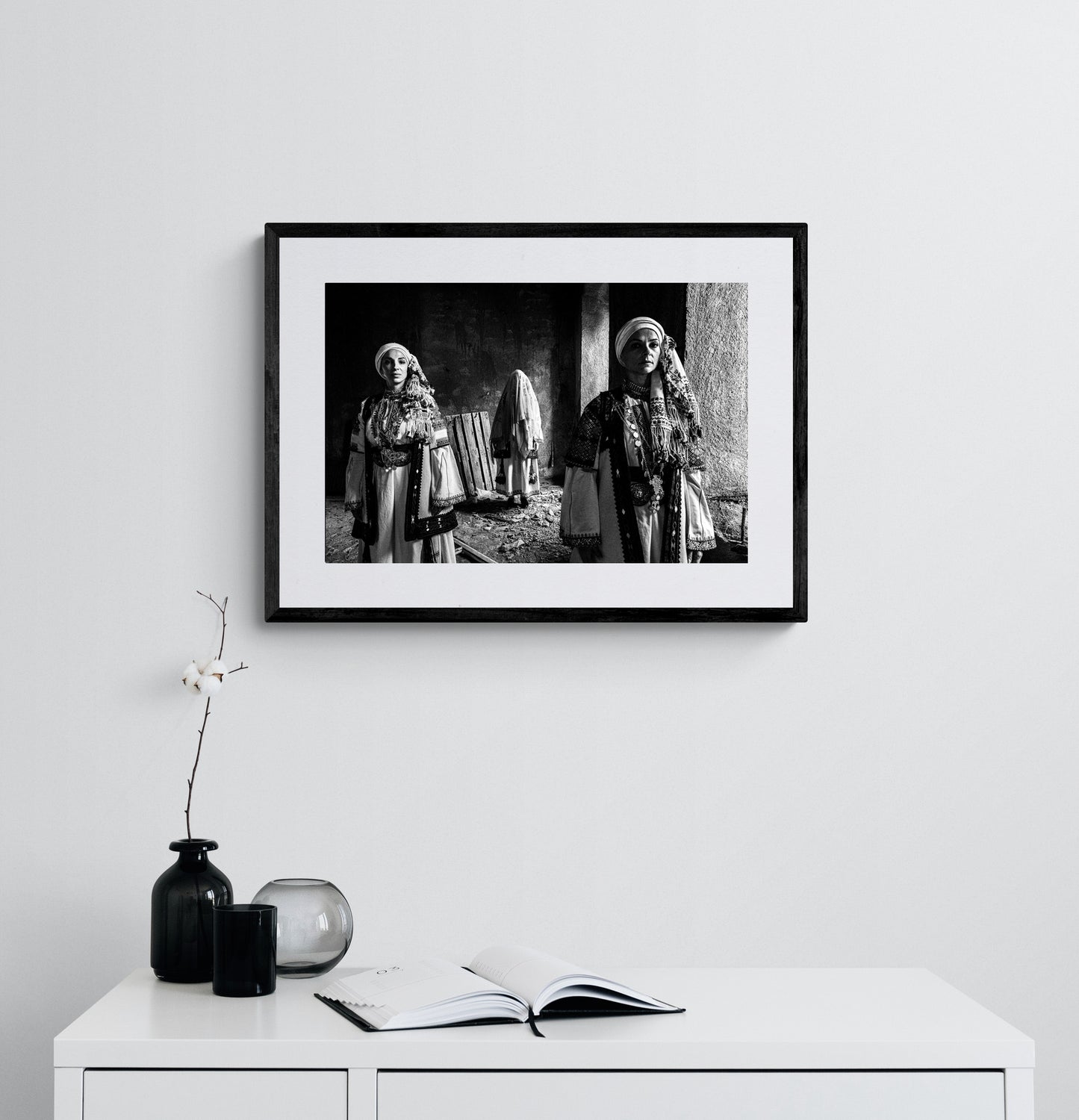 Veiled bride and two women in Kyparissia costumes, Peloponnese, Greece. Black and white photography framed on a wall by George Tatakis.