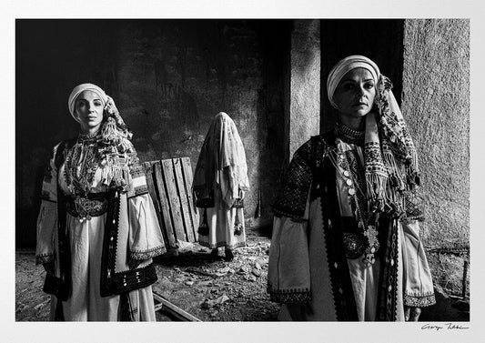 Veiled bride and two women in Kyparissia costumes, Peloponnese, Greece. Black and white photography by George Tatakis.