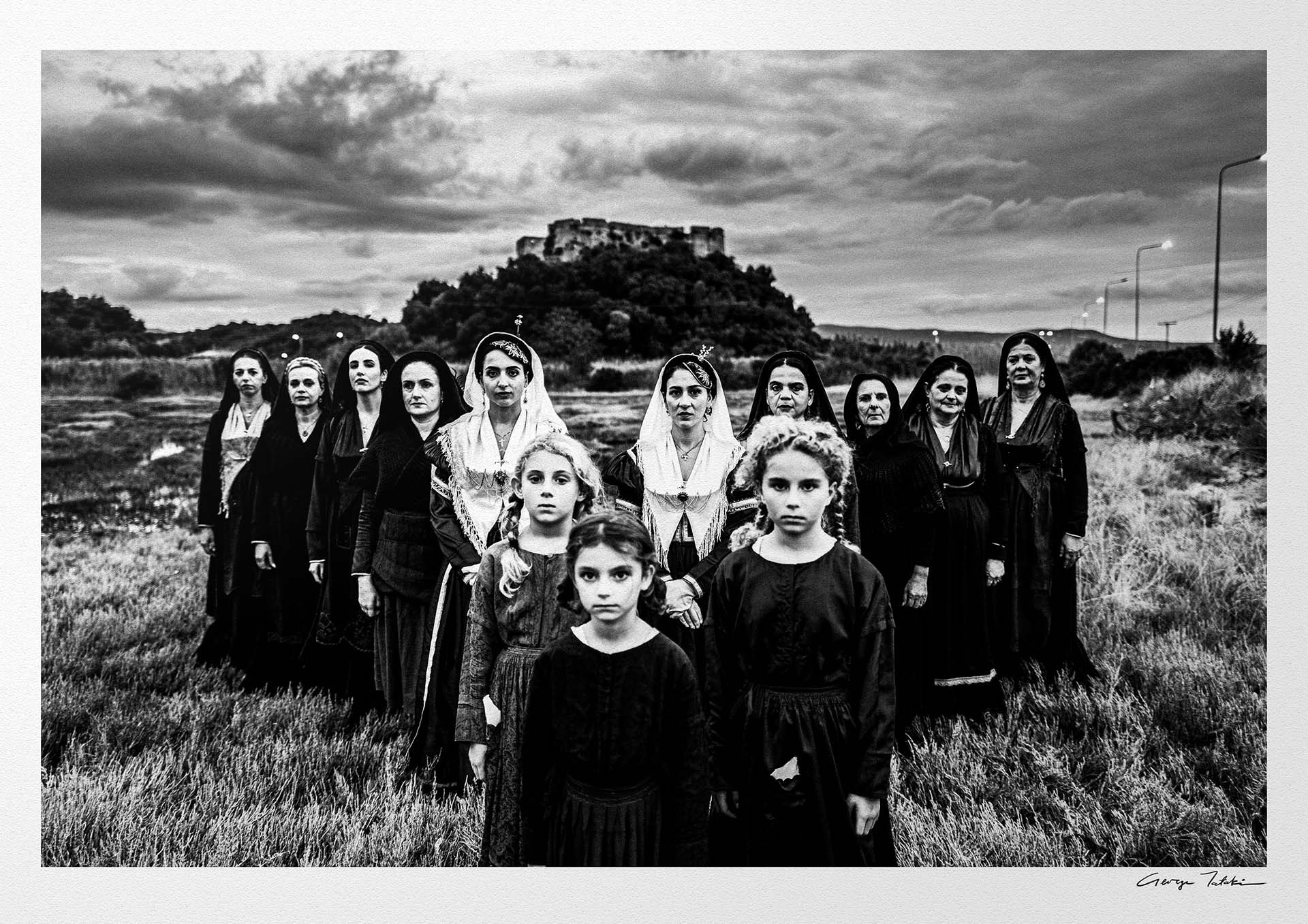 Black and White Photography Wall Art Greece | Costumes of Lefkada island at a castle multiple generations Ionian Sea by George Tatakis