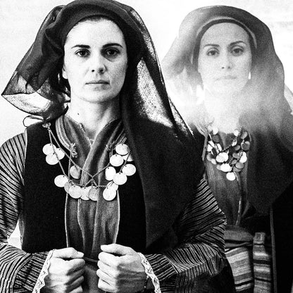 Four women in Alagonia local costumes at the church of the Mandraki Monastery, Alagonia, Peloponnese, Greece. Black and white photography close-up detail by George Tatakis.
