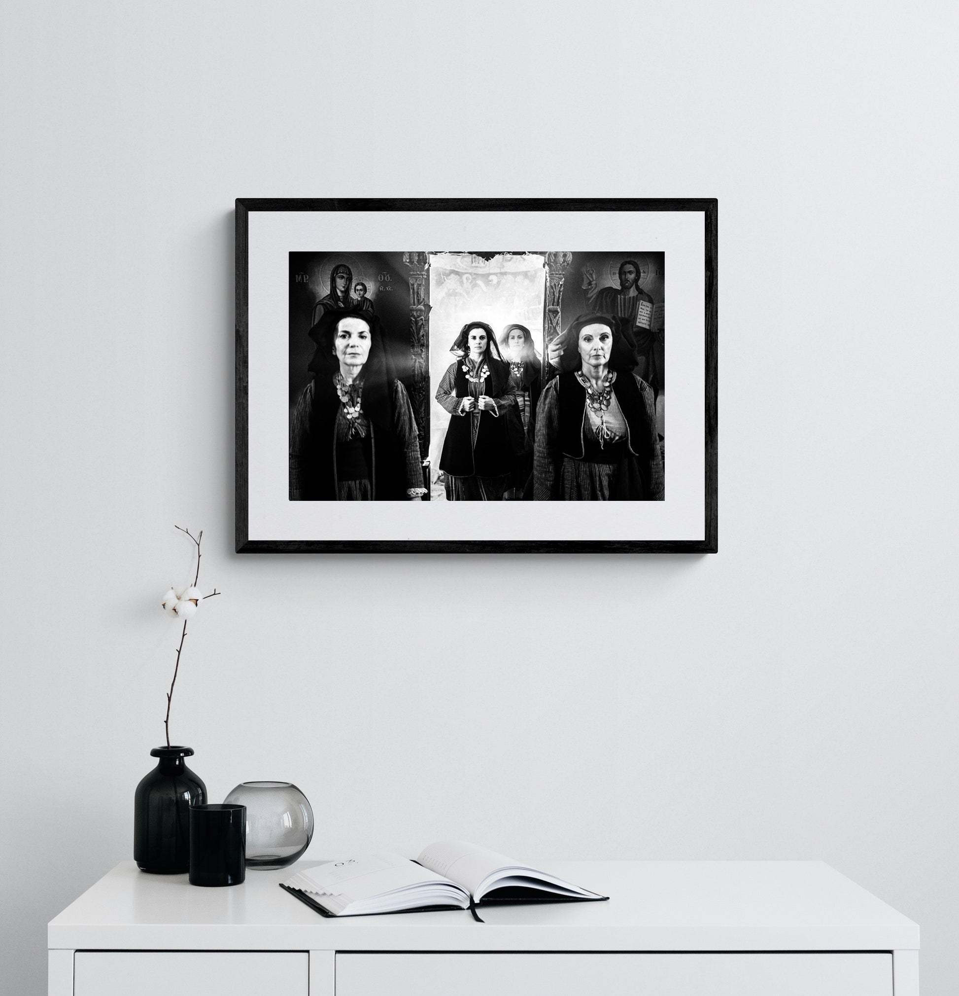 Four women in Alagonia local costumes at the church of the Mandraki Monastery, Alagonia, Peloponnese, Greece. Black and white photography framed on a wall by George Tatakis.