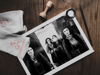 Four women in Alagonia local costumes at the church of the Mandraki Monastery, Alagonia, Peloponnese, Greece. Black and white photography print on table by George Tatakis.