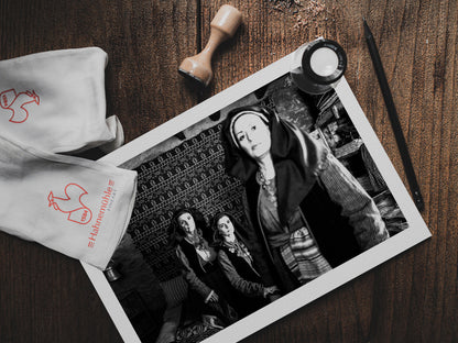 Three women in Alagonia local costumes. Nedoussa, Peloponnese, Greece. Black and white photography print on a table by George Tatakis.