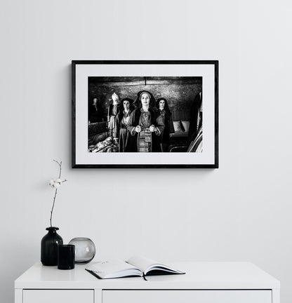 Three women in local dresses at Nikitaras house, Nedoussa, Alagonia, Peloponnese, Greece. Black and white photography framed on a wall by George Tatakis.