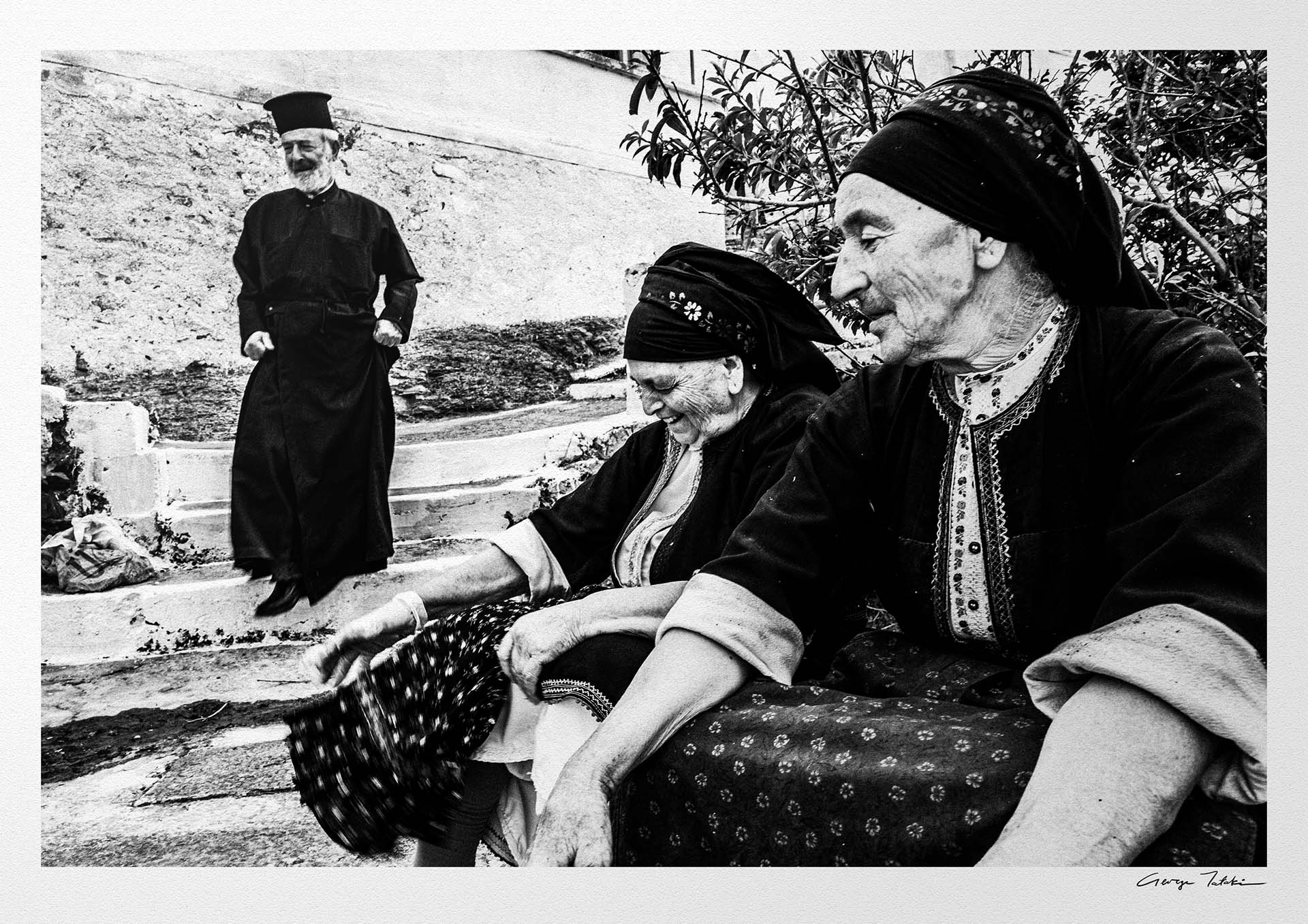 Black and White Photography Wall Art Greece | Two women in their traditional costumes the priest Olympos Karpathos Dodecanese by George Tatakis