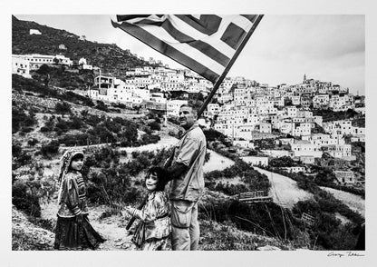 Black and White Photography Wall Art Greece | Carrying the Greek flag in Olympos Karpathos Dodecanese by George Tatakis