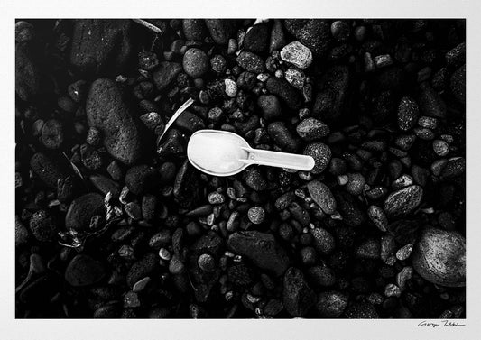 Black Pebbles and Shovel | Santorini | Chorōs | Black-and-white wall art photography from Greece