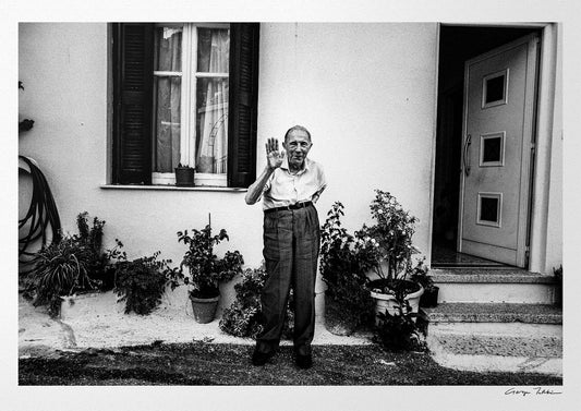 Black and White Photography Wall Art Greece | A man waving at Spilli Rethymnon Crete