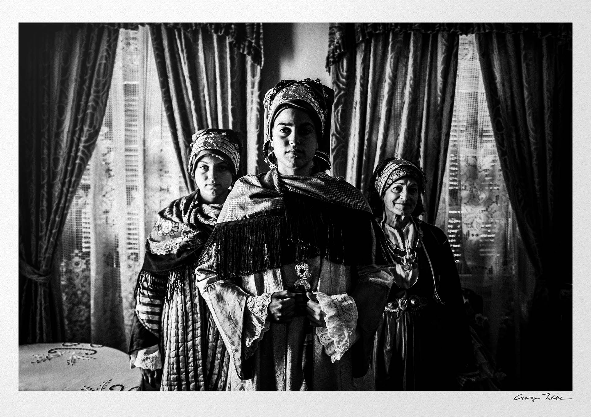 Black and White Photography Wall Art Greece | Three ladies in the traditional costumes of Symi island inside a house Dodecanese Greece by George Tatakis