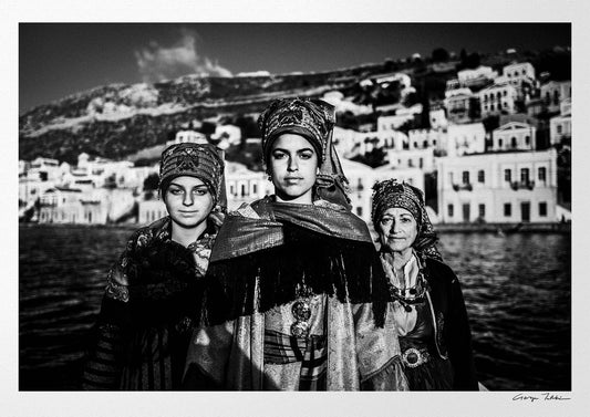Black and White Photography Wall Art Greece | Three ladies on a boat in the traditional costumes of Symi island Dodecanese Greece by George Tatakis