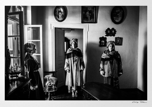 Black and White Photography Wall Art Greece | Three ladies in the traditional costumes of Symi island inside a room with frames Dodecanese by George Tatakis