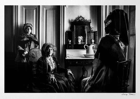 Black and White Photography Wall Art Greece | Three ladies in the traditional costumes of Symi island inside a house Dodecanese Greece by George Tatakis